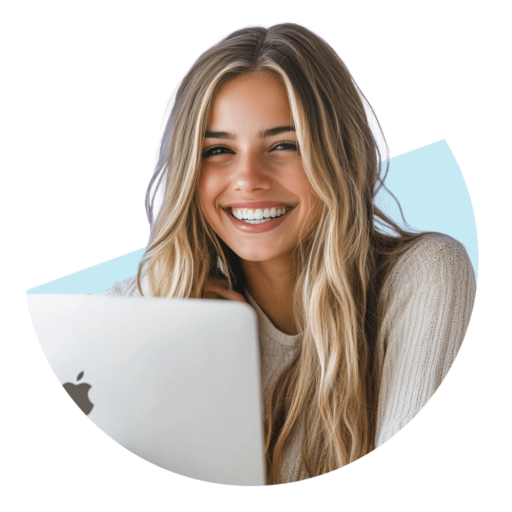 Picture of a girl in front of a computer, smiling